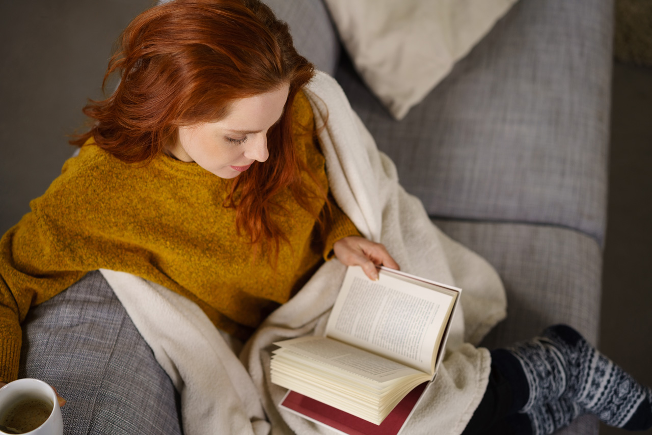 A girl is reading book. 